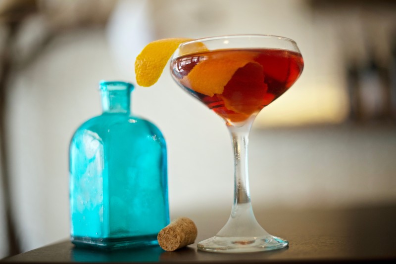 A specialty cocktail made of Soju vodka, Tawny Port, orange bitters and served with an orange twist at Tasca Tasca Portuguese Tapas Restaurant & Wine Bar in Sonoma. (Photo Credit: Erik Castro)