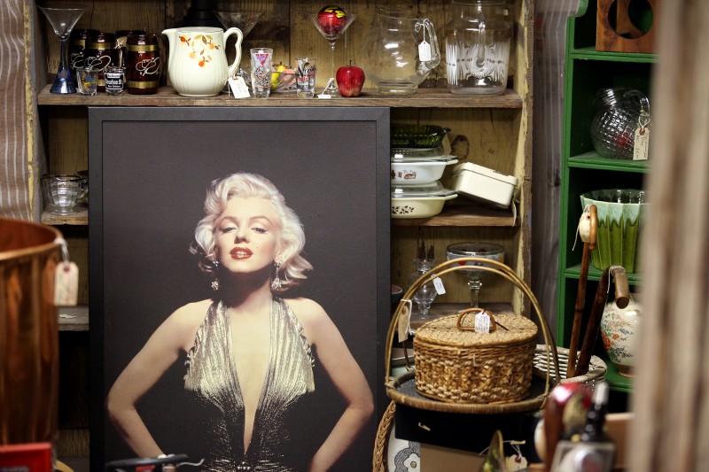 A large framed poster of Marilyn Monroe sits among a medley of items for sale at Whistlestop Antiques in Santa Rosa's Railroad Square. Christopher Chung