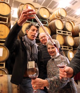 Mazzocco Winery winemaker Antoine Favero, from left, does a barrel tasting with Darrel Bihr and Carol Bihr during the 2010 Winter Wineland held all over Northern Sonoma County. (photo by Crista Jeremiason)