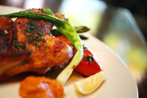 Chicken mattone is served at the Rustic restaurant at Francis Ford Coppola Winery. (Conner Jay/The Press Democrat)