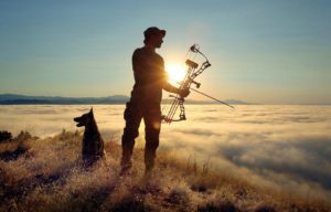 Jayson Collard, with his dog, Maliki, guides hunters into land above Lake Sonoma for hunting wild pigs. (photo by John Burgess/The Press Democrat)