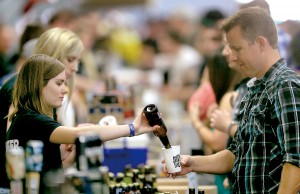 One bottle at a time at Battle of the Brews at the Sonoma County Fairgrounds, Saturday April 6, 2013 in Santa Rosa. (Kent Porter / Press Democrat)