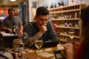 Mike Velzo of Chicago playing a game of Rummikub with his wife Christina Velzo at Bergamot Alley Bar & Wine Merchants in Healdsburg.