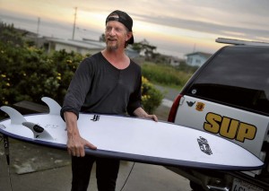 Longtime wave chaser Bob Miller loads his car for an early morning surf trip from his home at Carmet Beach north of Bodega Bay.