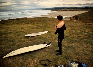 Daniel Arreguin sheds his wetsuit after a winter surfing session at Fort Bragg.