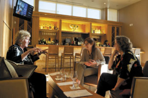 Helen Dunn, left, Carolyn Rausch and Nancy Lyons chat over cocktails in the bar at Prelude. 