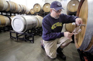 Scot Covington, whom Edwards mentored, samples wine from a barrel at Trione Vineyards and Winery in Geyserville. Covington has made wine with the Trione family since 2005.