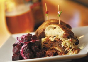 The pulled pork sandwich comes with a side of beet salad from chef Jeff Young of Twist in Forestville. (John Burgess)