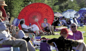 Valerie Hesse, right, of Santa Rosa, joined friends Julie Paille and Emma Stone on the lawn for the Green Music Center's 2013 Fourth of July Celebration. 