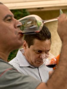 Sommeliers Orlando Pe'alver, left, and Orlando Blanco taste a Klinker Brick 2012 Old Ghost old vine zinfandel from Lodi during the Cuban Sommelier Summit at Ramekins in Sonoma. (photo by Alvin Jornada)