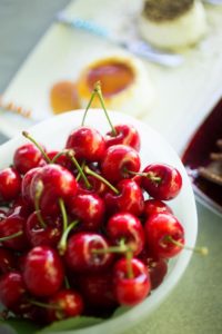 Homemade chevre along with freshly picked cherries.