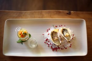 Oysters with white verjus and pickled cucumber are served with a yellow tomato panna cotta and local clams at Partake by K-J restaurant in Healdsburg. (Conner Jay/The Press Democrat) 