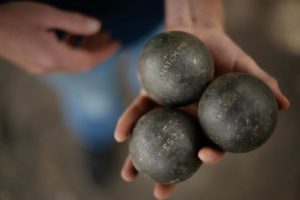 Wolfgang Kurz, 23 and member of the Valley of The Moon Pétanque Club with a set of pétanque balls at Depot Park in Sonoma. (Photo by Erik Castro) 