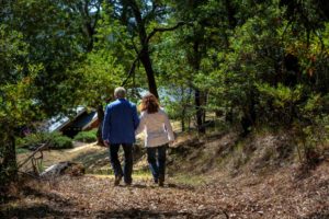 Sam and Robin Sebastiani walk down the old quarry road that runs through the backyard to their home.