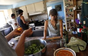 Interns make lunch in their house at Green String Farm in Petaluma. (photo by Beth Schlanker)