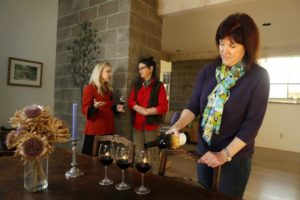 From the left, Jonjie Lockman, Julie Johnson and Michaela Rodeno enjoy a bottle of Rodeno's wines at her home in Oakville.