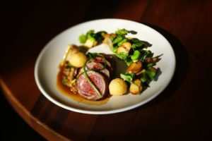 Sonoma lamb loin with fava beans, porcini mushrooms and spring garlic is served at Torc Restaurant in Napa. (Photo by Conner Jay)
