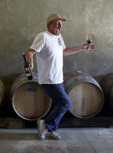 Richard Kasmier, owner/winemaker/cellar worker for the tiny KAZ Winery, dazzles his guest with a dance while pouring newer wines as part of the Savor Sonoma Valley weekend. (photo by John Burgess)