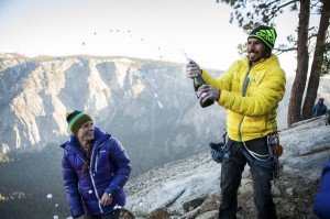 Kevin Jorgeson pops a bottle of sparkling wine to celebrate his historic free-climb ascent of El Capitan’s Dawn Wall, as Becca Caldwell, the wife of his climbing partner Tommy Caldwell, looks on, in Yosemite National Park, Calif., Jan. 14, 2015. Both climbers’ partners were on hand at the end of a climb that took 19 days. (Max Whittaker/The New York Times)