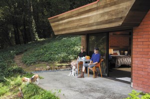 Tudor-Jackson (in blue shirt) and his spouse, Douglas Atkin, enjoy the outdoors with their dogs, Sir Oliver and Lady Margaret. 