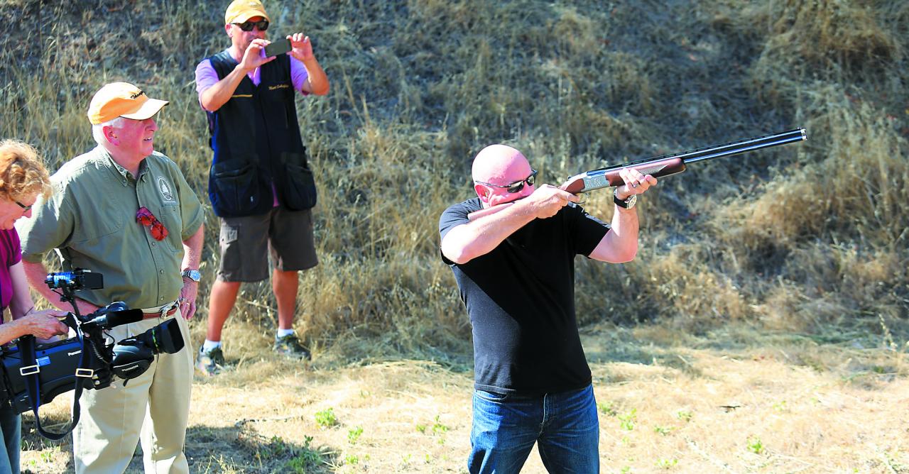 Mike Thompson, left, watches his friend retired astronaut Mark Kelly shoot sporting clays at the Napa Police practice range in 2013. Kelly’s wife, then-Congresswoman Gabrielle “Gabby” Giffords, survived an assassin’s shooting attack in 2011 but suffered severe brain damage that ended her political career. (Kent Porter / Press Democrat)