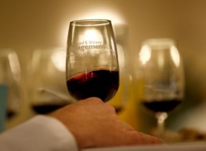 Judge Chris Sawyer swirls a glass of wine during the North Coast Wine Challenge at the Hilton Sonoma Wine Country Hotel in Santa Rosa, on Tuesday, April 12, 2016. (BETH SCHLANKER/ The Press Democrat) 