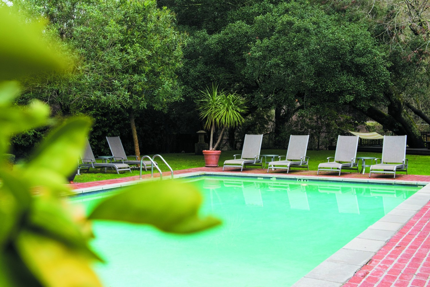 The pool awaits in a serene setting.