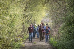 A group of hikers make their way along the newly opened Discovery Trail along the Laguna de Santa Rosa. Laguna Foundation officials led a guided hike sharing stories of the restoration effort. (Jeremy Portje / For The Press Democrat)