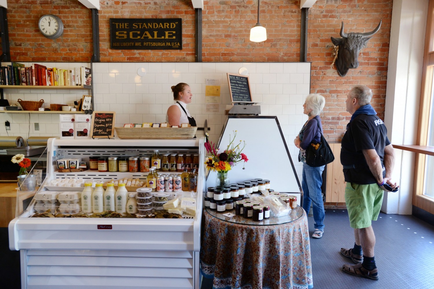 ucy O' Dea working the meat counter at Thistle Meats in downtown Petaluma. (Erik Castro / The Press Democrat) 