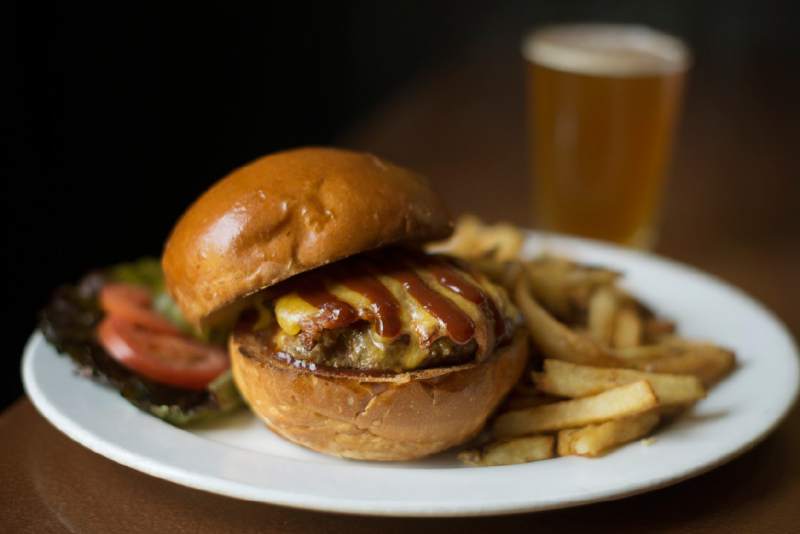 Smokey Sebastopol burger with bacon, cheddar and in-house made barbecue sauce at Barley and Hops Tavern in Occidental. May 16, 2016. (Photo: Erik Castro