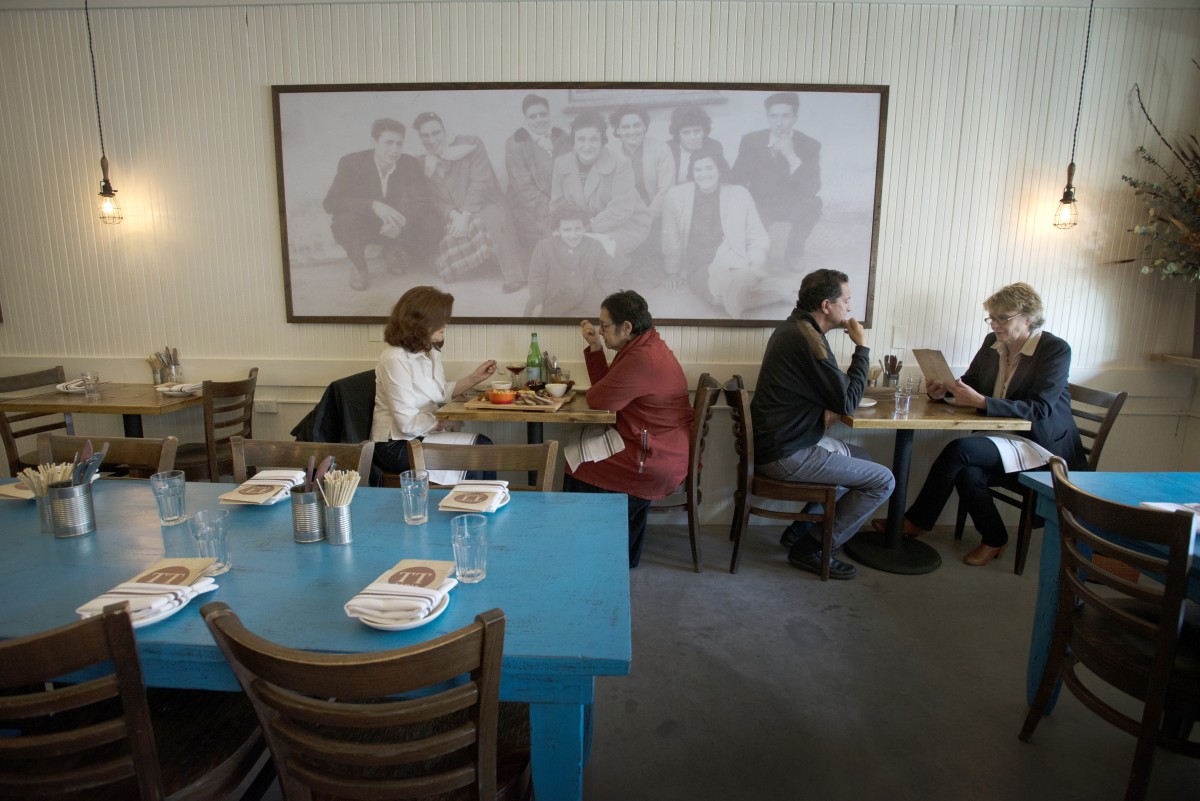 The walls of Tasca Tasca Portuguese Tapas Restaurant & Wine Bar in Sonoma are decorated with large photos of Manuel Azevedo's family when they lived in Azores, an autonomous island region of Portugal.