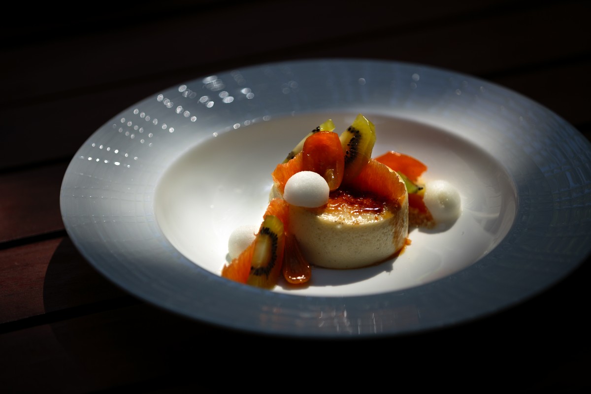 Lisa Kaufman’s crème brûlée cheesecake with compressed kiwi and oranges.