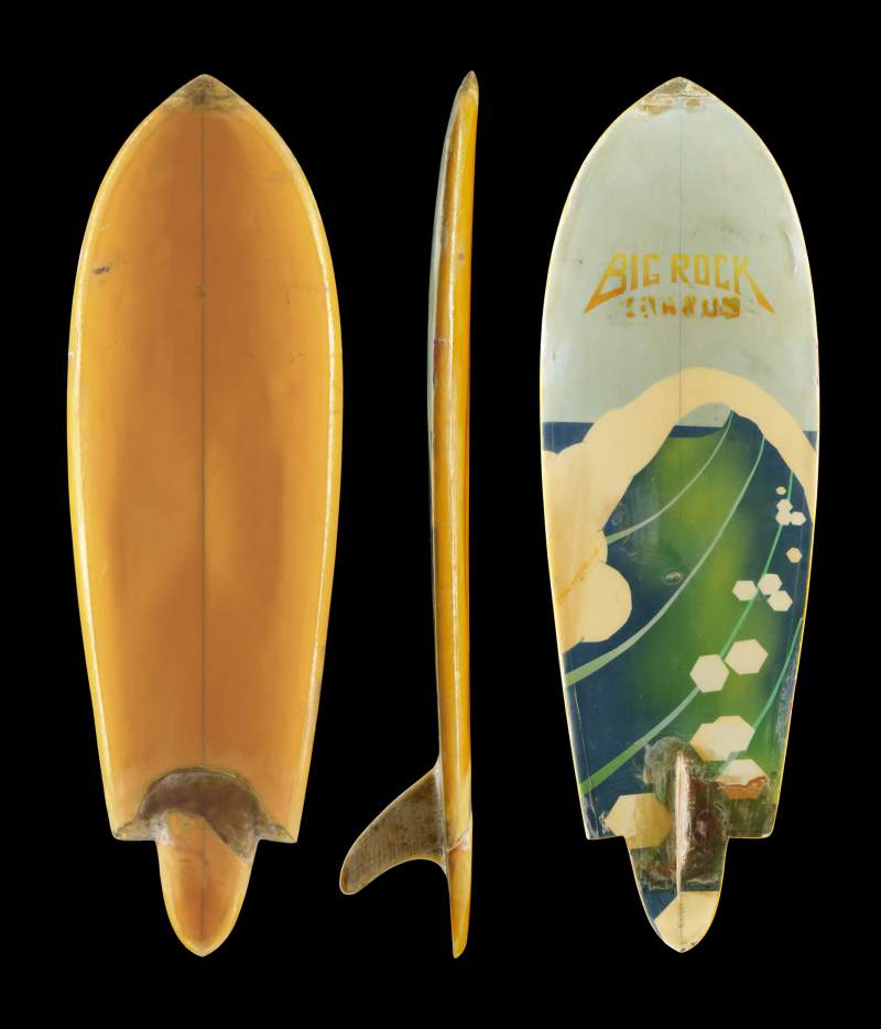 "Weird Board", a single fin stinger shaped by Hans Newman, 1972. Made of Polyurethane foam, fiberglass, and resin. Hand painted. 5’2” x 19.25: x 2.75”. Collection of Hans Newman.