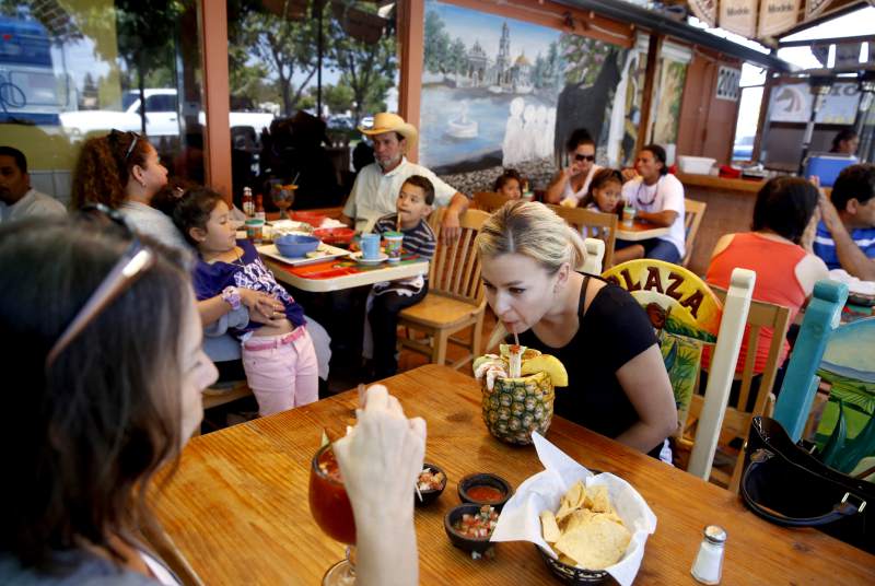 Natasha Wawiluk sips on a Pina Chavela made with beer, Clamato and spices during lunch with her mother at Mi Terra Mexican Restaurant in Santa Rosa.