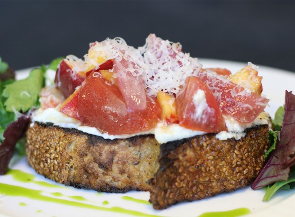 Dry Creek Peach + Heirloom Tomato Salad with Bellwether Ricotta, Pickled Red Onions and Rustic Toast at Dry Creek Kitchen. Heather Irwin/PD