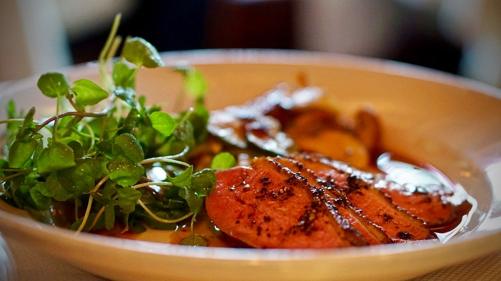 Sonoma County duck breast au poivre with Lucero Farms squash gratin, roasted cèpes, and watercress