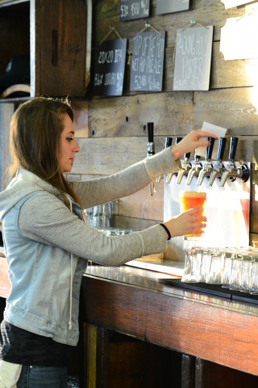 Morgan pouring brews at Grav South Brew Co. in Cotati. (Photo by Tim Vallery)