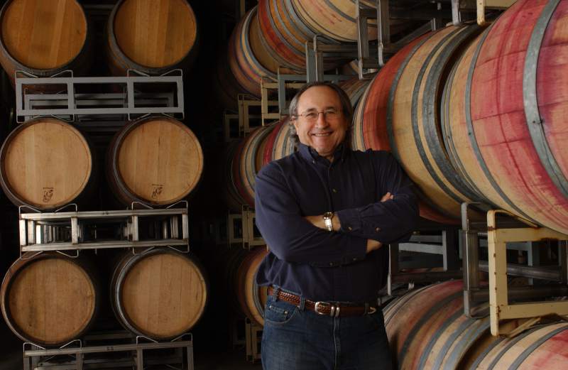Vintner Greg Graziano with aging wine barrels.