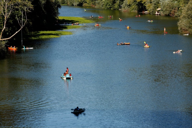 People float down the Russian River by various methods of transportation towards Johnson’s Beach in Guerneville. (Alvin Jornada / The Press Democrat) 