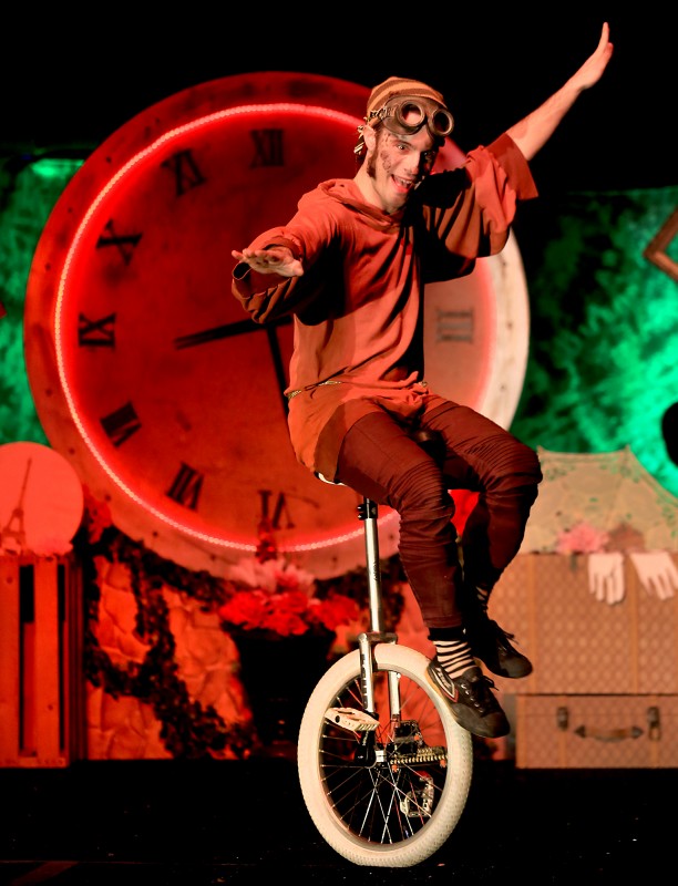 Le Cirque de Bohme unicycler Colin Creveling entertains a crowd under the big top at Cornerstone Gardens in Sonoma, Saturday Dec. 26, 2015. (Kent Porter)