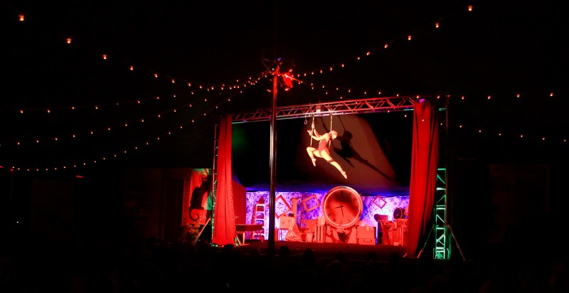 Cola Claret of Le Cirque de Bohme performs on a trapeze under the big top at Cornerstone Gardens in Sonoma, Saturday Dec. 26, 2015. (Kent Porter)