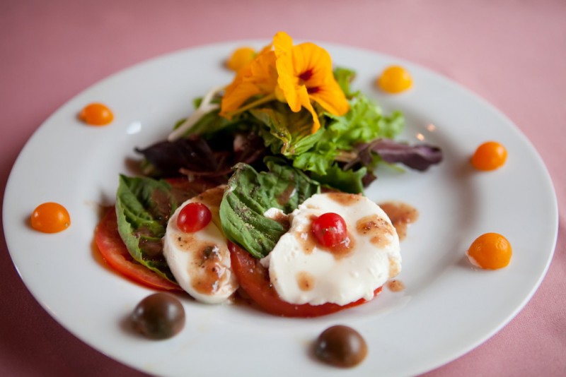 Mixed green salad with persimmon, candied pecans, and feta cheese. (Photo Courtesy of Sonoma Coast Villa)