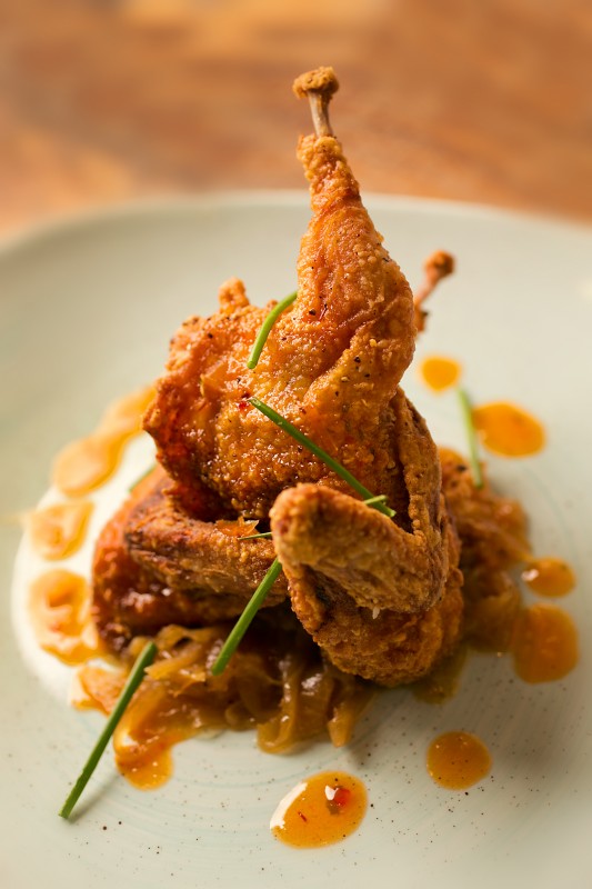 Buttermilk Brined Fried Quail with Caramelized Onions and Sweet Chili Vinaigrette at the Coast Kitchen in the newly remodeled Timber Cove Lodge on the Sonoma Coast. (John Burgess/The Press Democrat) 