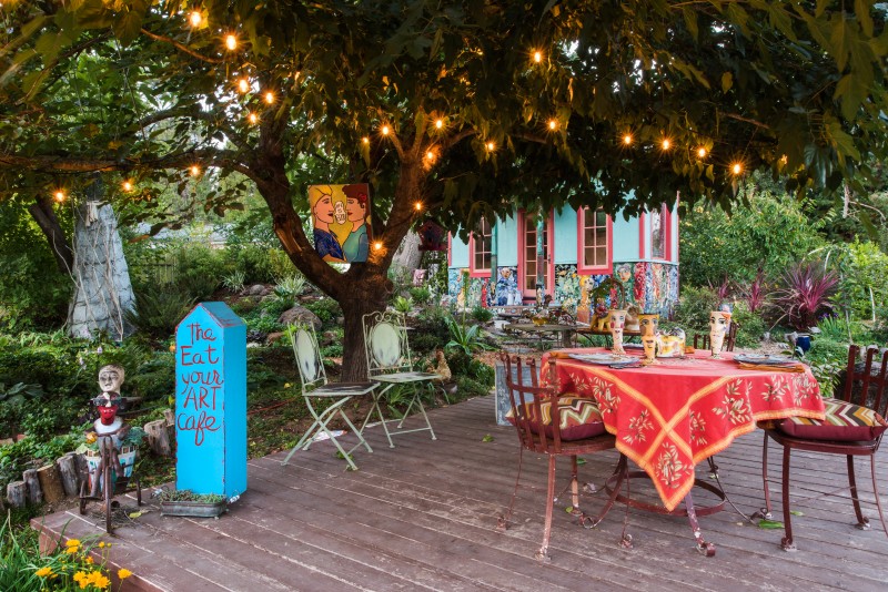 The backyard deck, dubbed “The Eat Your Art Cafe,” is a favorite spot for relaxation and teatime.