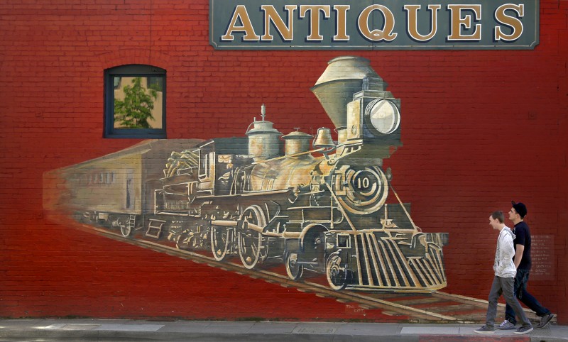 A mural of a steam engine on the side of Whistlestop Antiques serves as the defacto entrance to the Historic Railroad Square district in Santa Rosa. The area is undergoing a transformation as wine bars, restaurants, furniture stores and the new SMART rail system are serving as a draw to an eclectic and diverse clientele. (Kent Porter