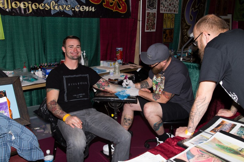 Jake St. George gets a tattoo at the Tattoo & Blues Festival at the Flamingo Hotel in Santa Rosa.