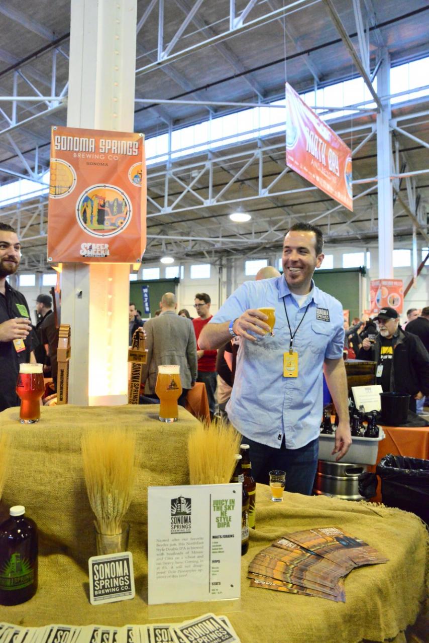 Derek from Sonoma Spring Brewing Company shows off his DIPA and Triple IPA at the SF Beer week gala in San Francisco. (Photo by Tim Vallery)