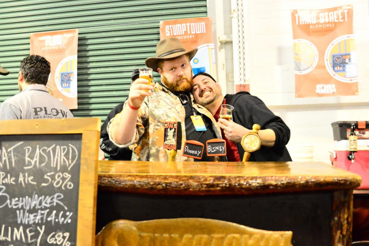 Nick Garson aka "Fridge" a local beer celebrity, hugs up on the Stumptown team as he assists them in pouring the brews at the Sf beer week opening gala. (Photo by Tim Vallery)