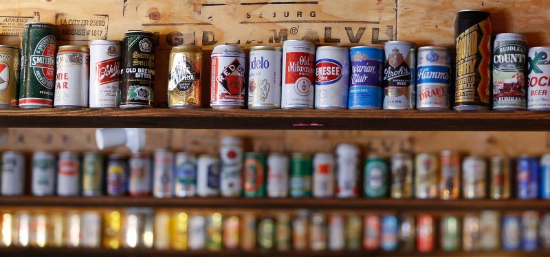 Vintage beer cans decorate the loft ceiling at Lagunitas Brewing Company in Petaluma, California on Tuesday, August 9, 2016. (Alvin Jornada