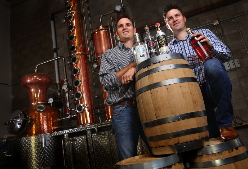 Twin brothers Chris, left, and Brandon Matthies own and operate Sonoma Brothers Distilling, in Windsor. The brothers produce their own line of gin, vodka and whiskey in their handmade Arnold Holstein copper pot still. (Christopher Chung)